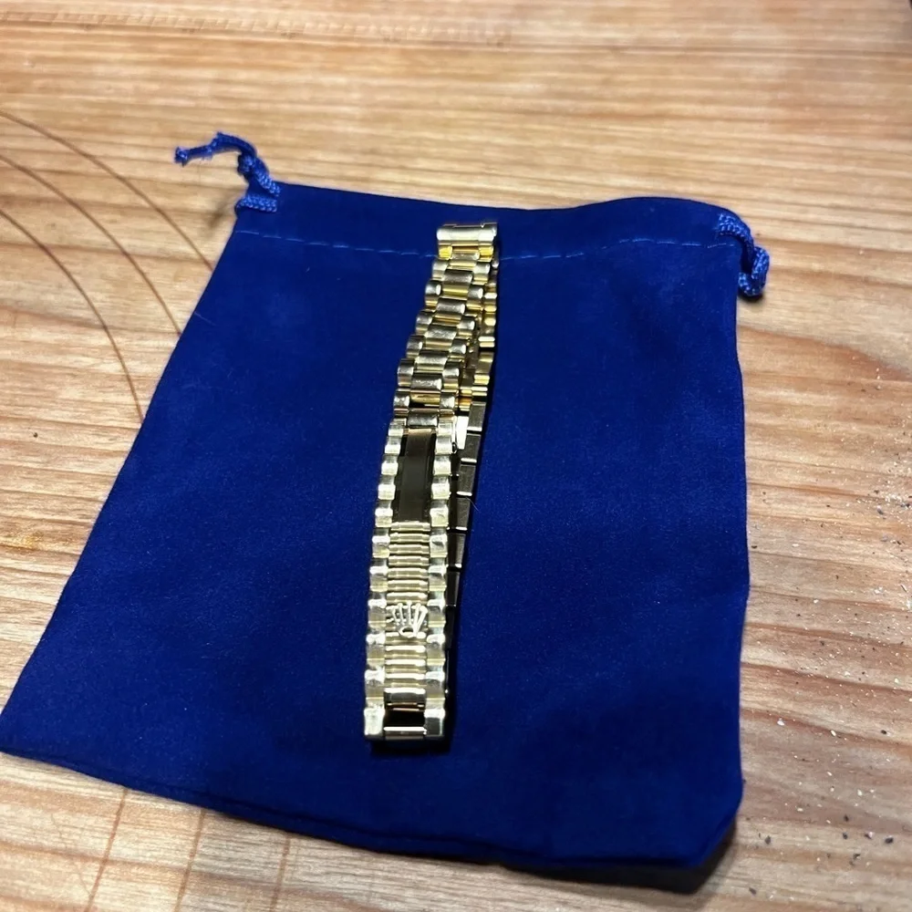 gold bracelet within crown on it. It is NOT a …. But your friends won’t know